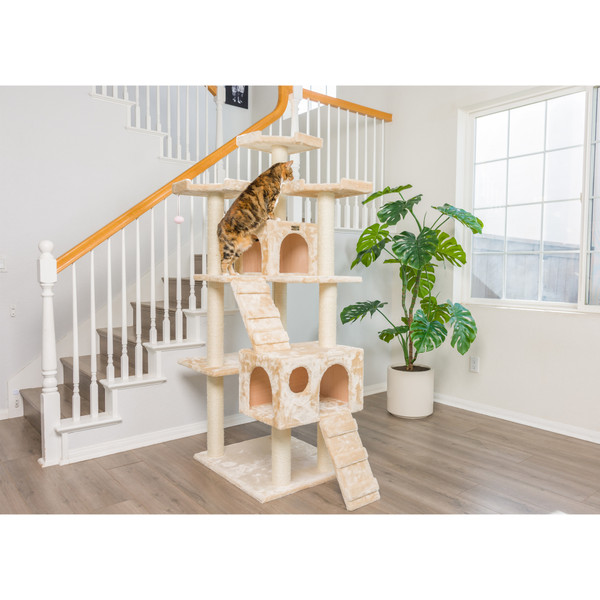 Armarkat 74-inch cat tree with dual condos near a staircase, cat climbing it