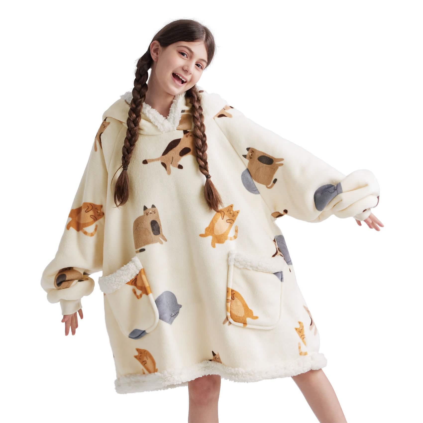 Tween girl wearing a cream Bedsure sherpa blanket hoodie with cat and dog print
