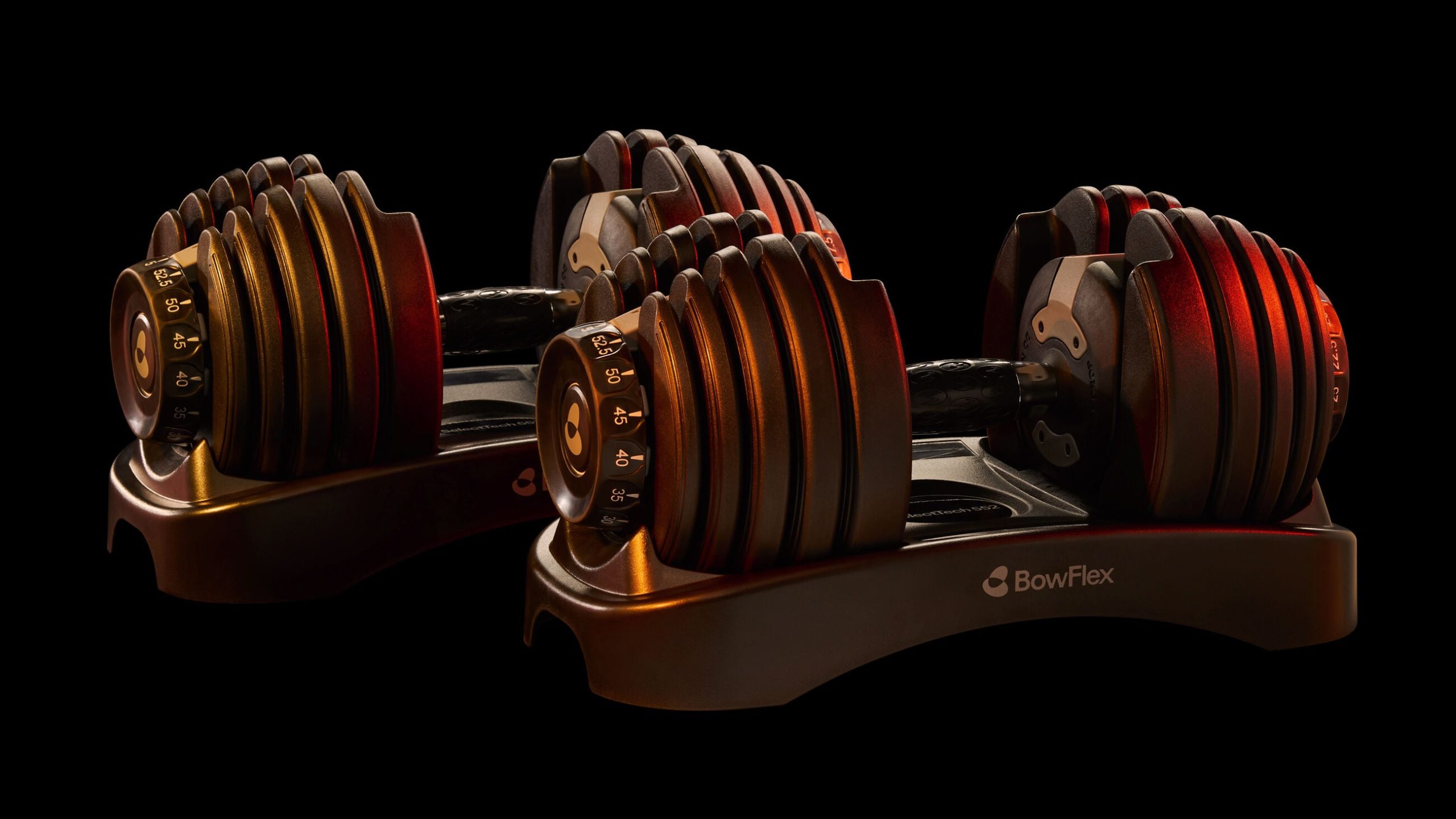 Bowflex SelectTech 552 adjustable dumbbells with dial system, real BowFlex branding visible
