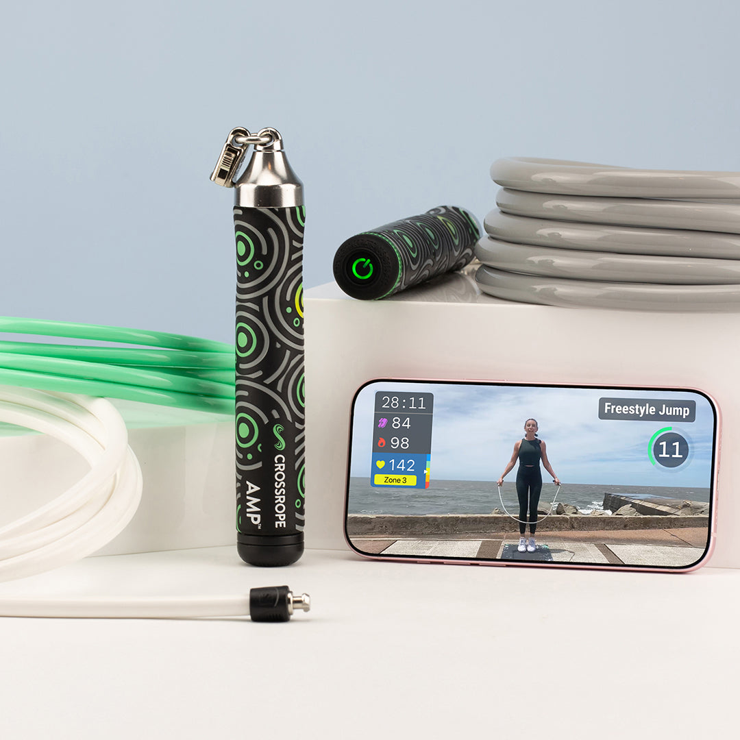 Crossrope AMP smart jump rope set with Bluetooth handle and app displayed on phone