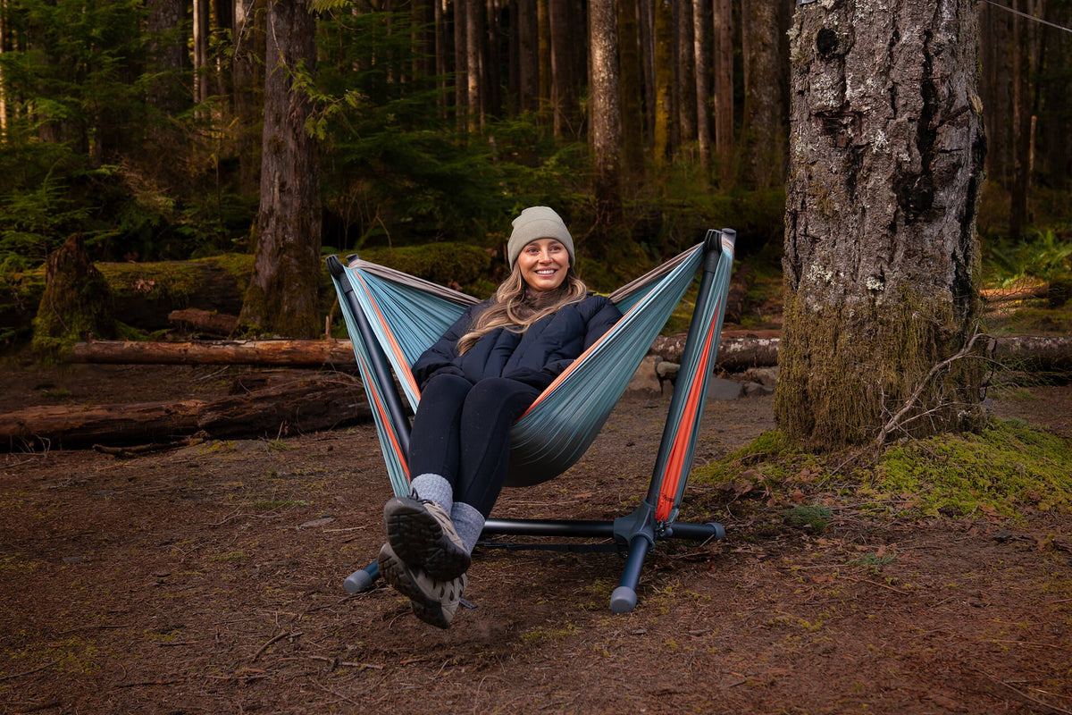 ENO DoubleNest Hammock set up between two trees in the forest