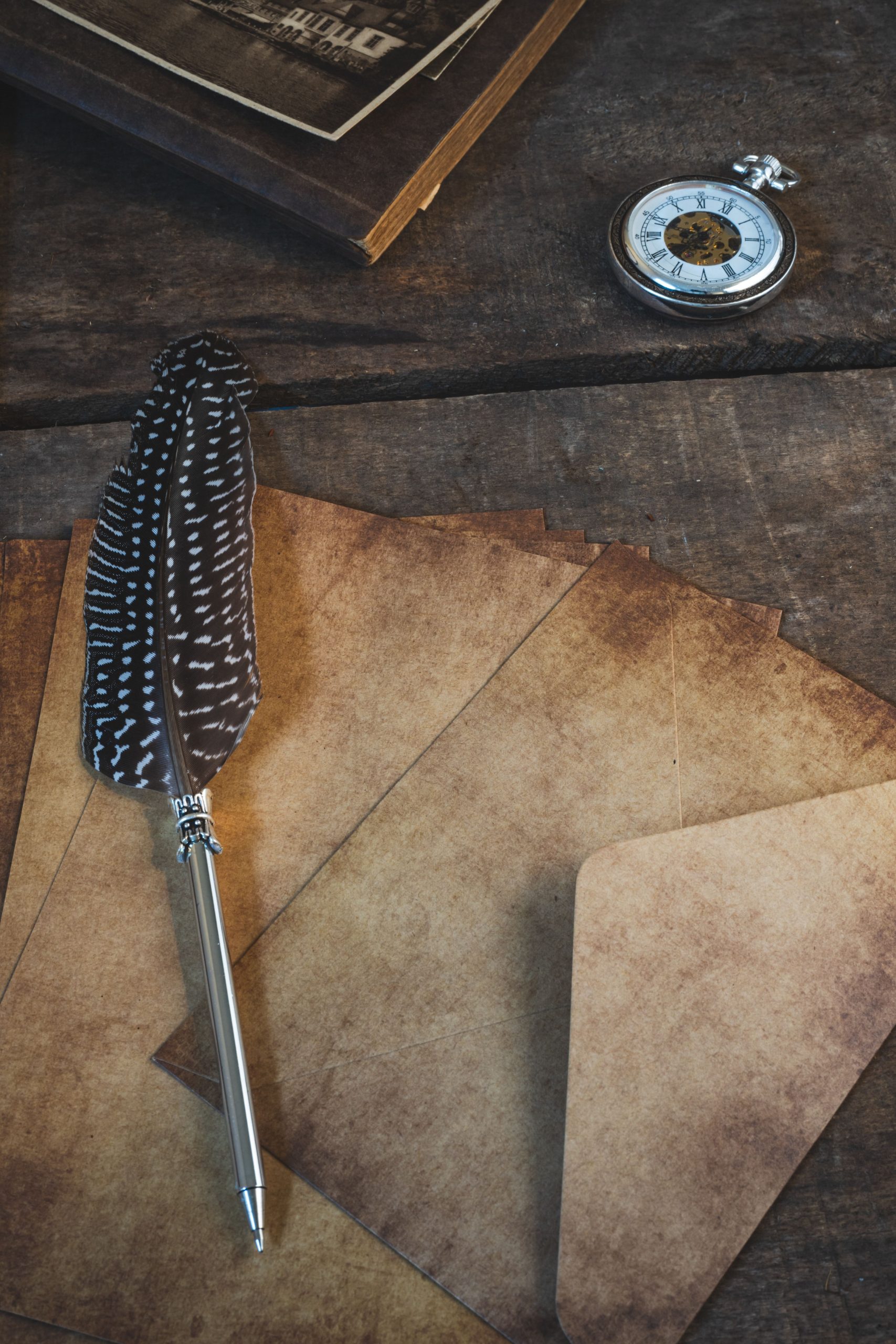 Vintage-style folio kit with quill pen and antique paper