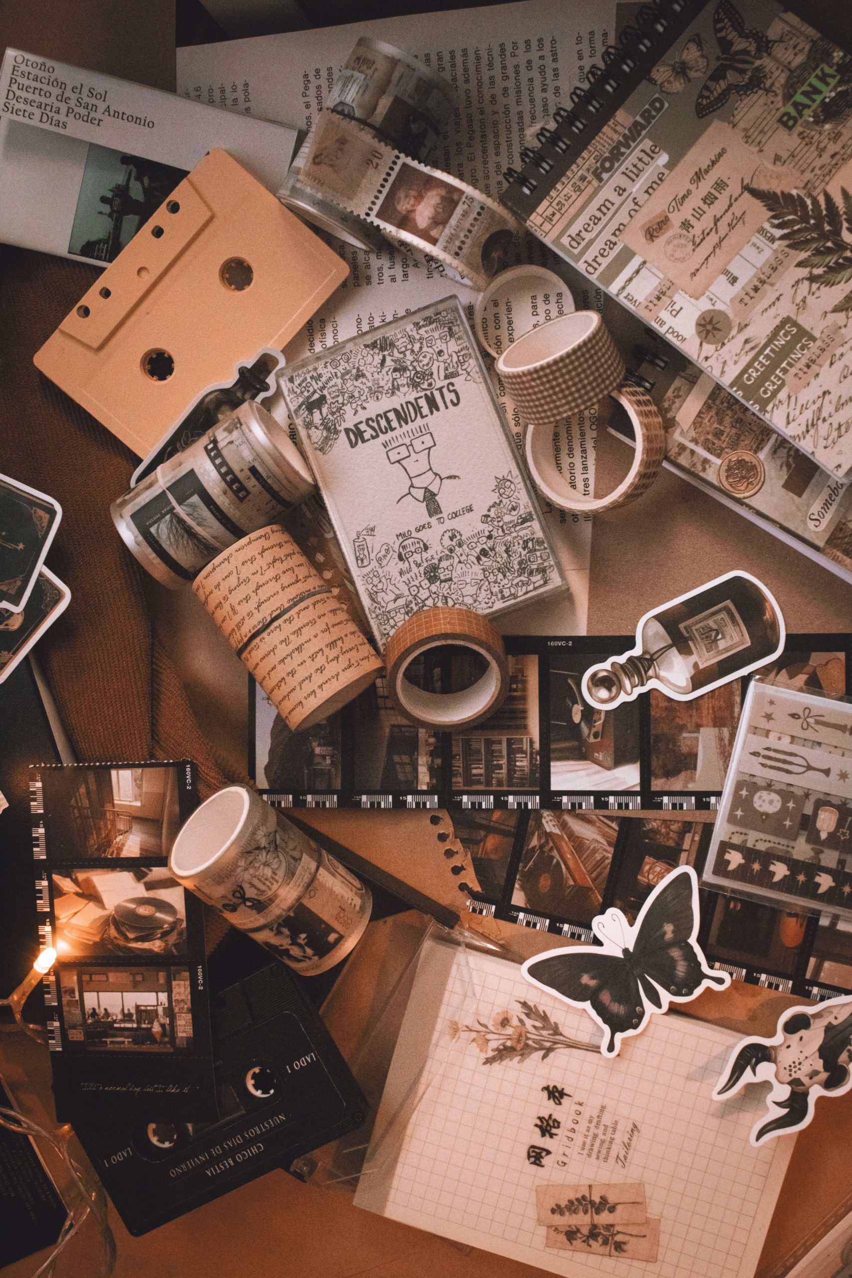 Vintage ephemera flat lay with old photos, stamps, and paper scraps