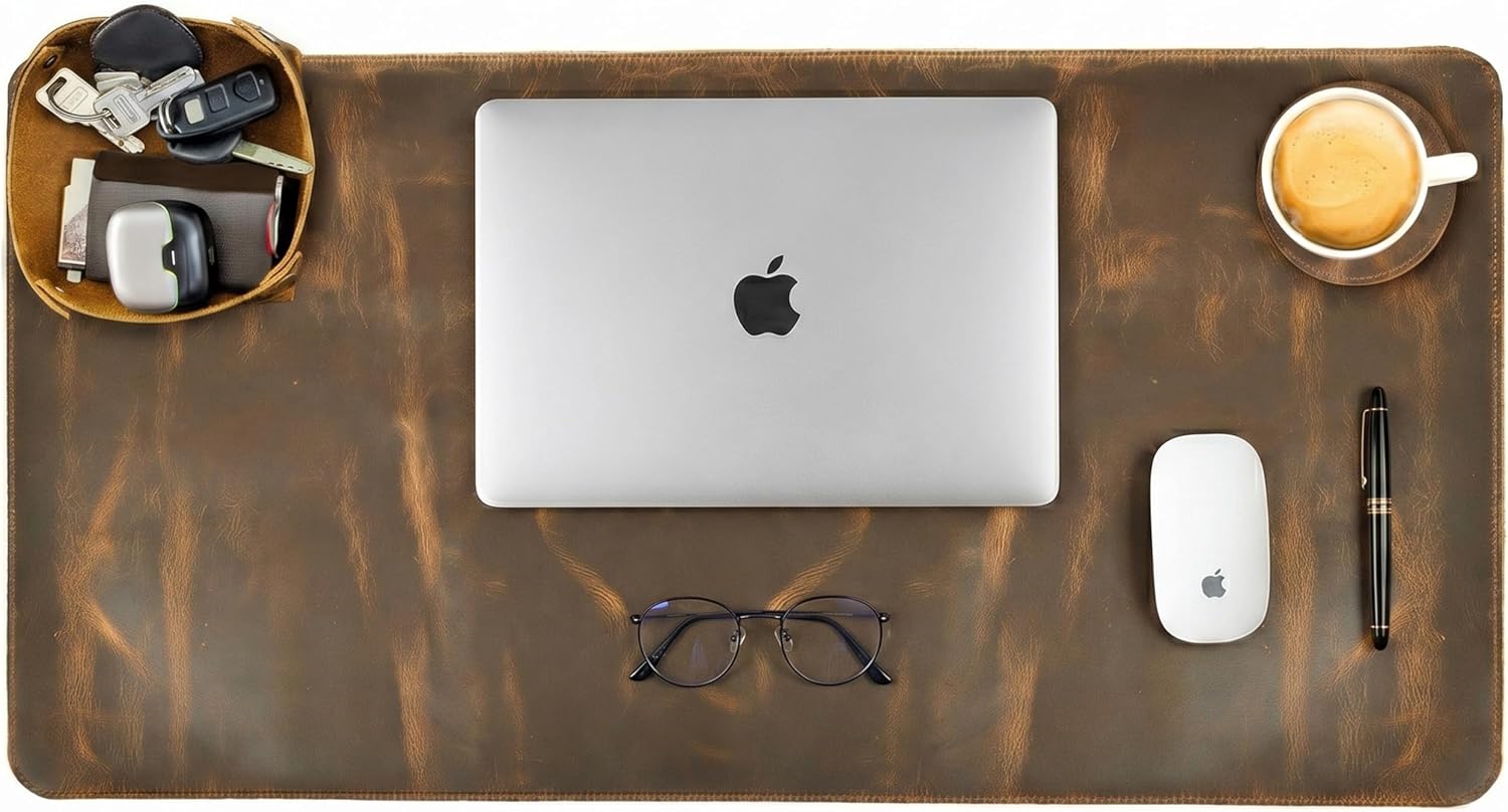 Large brown leather desk mat with a laptop, mouse, and coffee cup on top