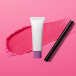 colorful lip stain and lip tint product collage on a bold pink background