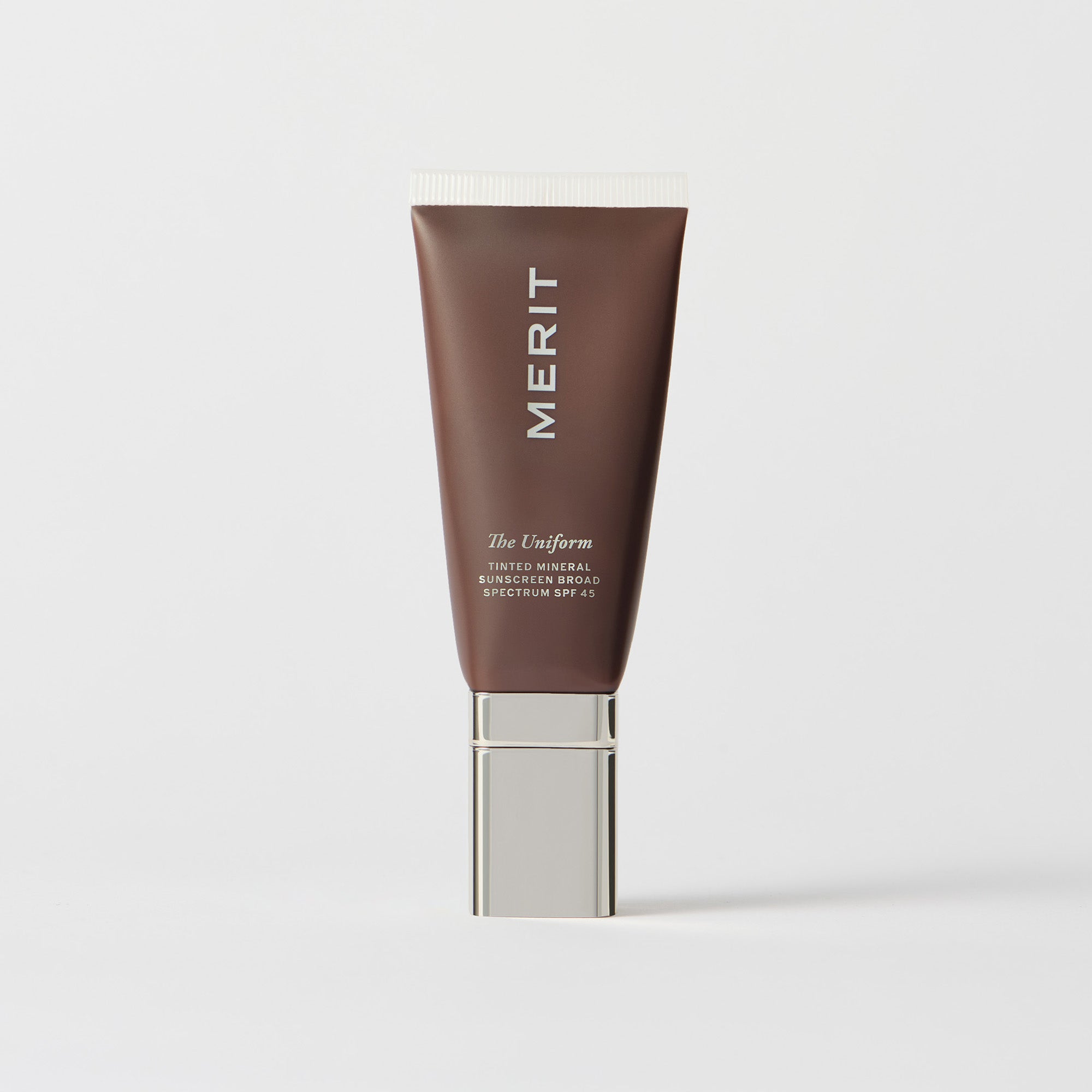 Merit The Uniform Tinted Mineral Sunscreen brown tube product photo