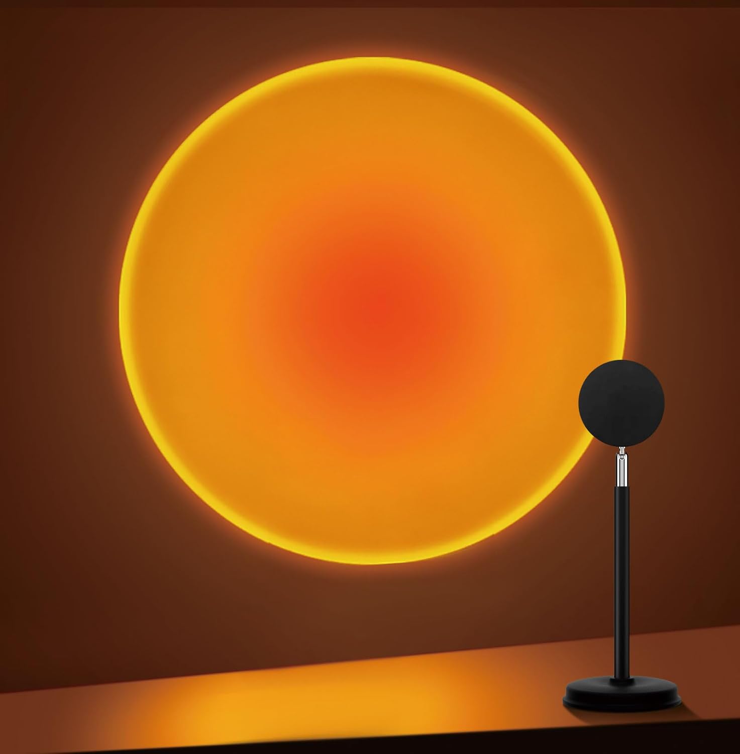 Sunset projection lamp casting a warm orange glow on a wall