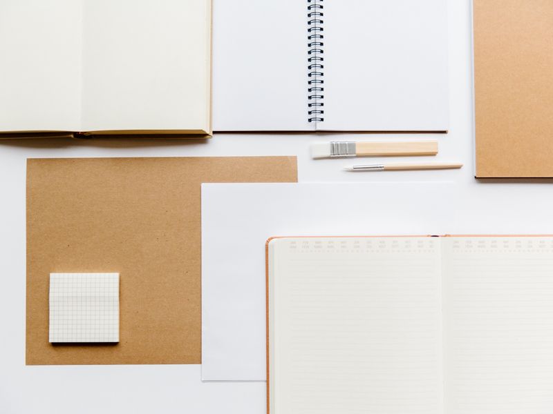 notebooks and planner supplies on a desk product photo