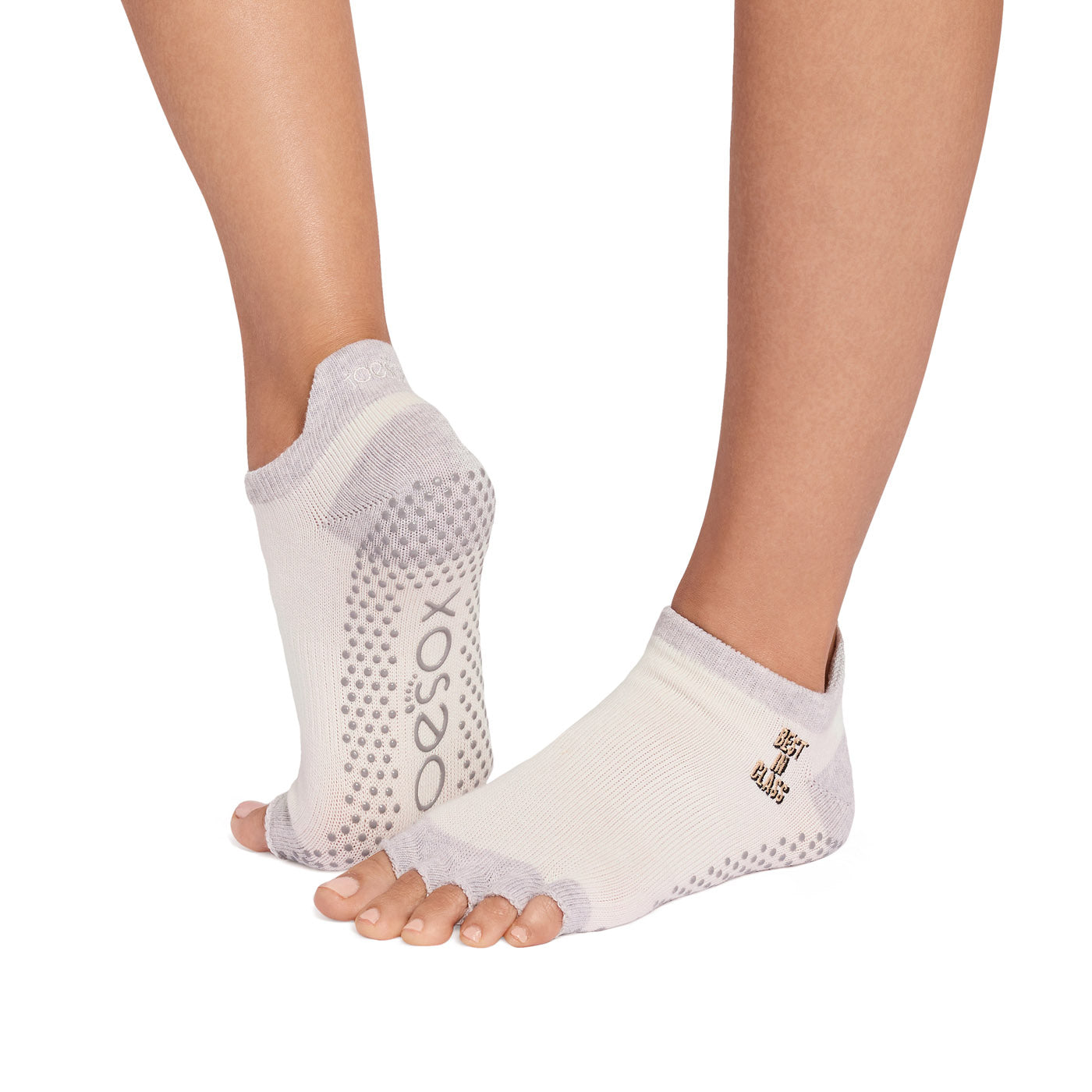 ToeSox half toe grip socks worn on feet showing non-slip sole