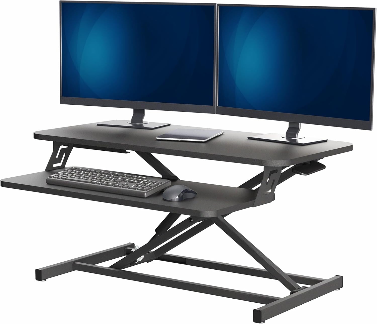 VIVO standing desk converter with dual monitors, a keyboard, and a mouse on top of a regular desk