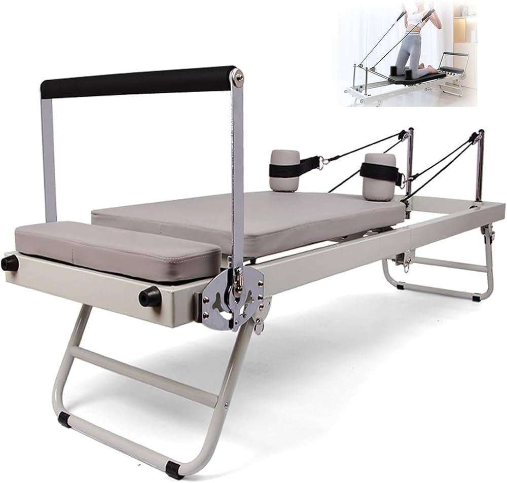 Foldable Pilates reformer machine with carriage, springs, and ropes