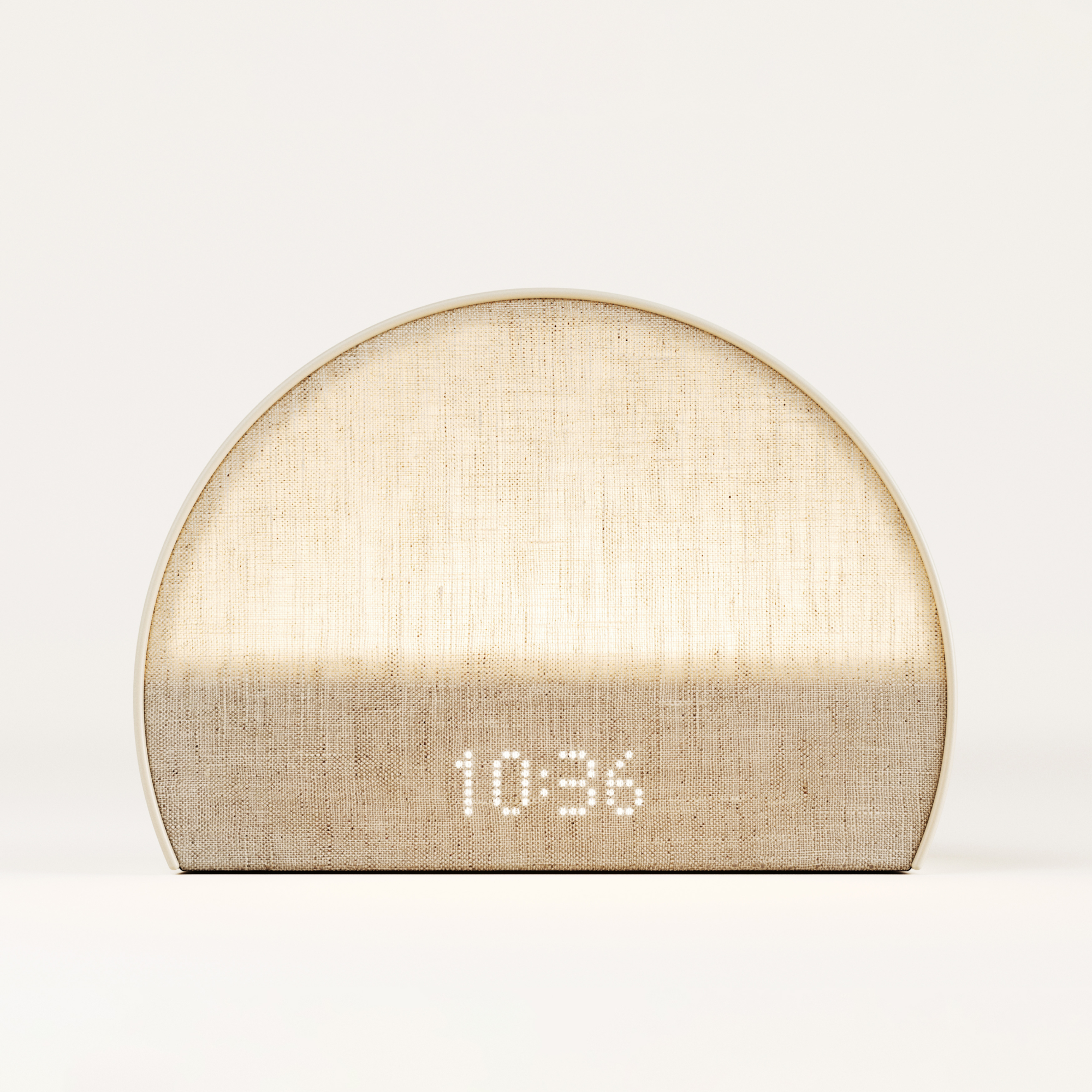 Hatch Restore 2 sunrise alarm clock and sound machine on a nightstand