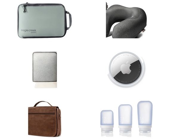 A clean grid of real travel packing essentials on white: Monos carry-on suitcase, Trtl neck pillow, Eagle Creek Pack-It cube, MLVOC neck pillow, BAGAIL compression cube, Apple AirTag, PAVILIA hanging toiletry bag, humangear GoToob+ bottles, Travel Inspira luggage scale, and a Master Lock TSA lock