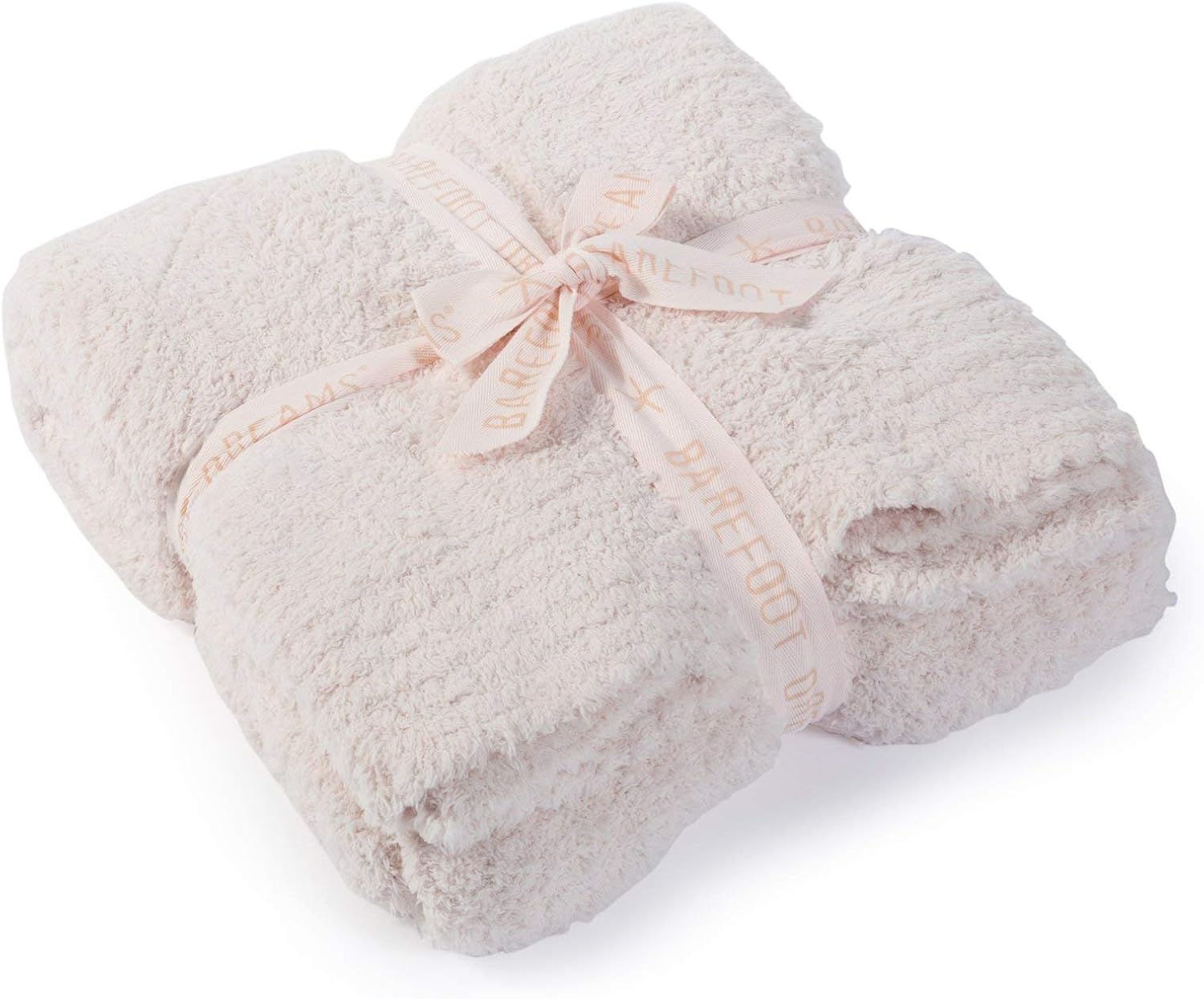Barefoot Dreams CozyChic throw blanket in cream, folded and tied with a ribbon